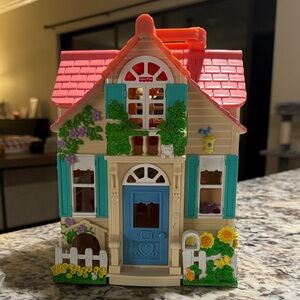 Fisher Price Sweet Streets Country Cottage dollhouse.